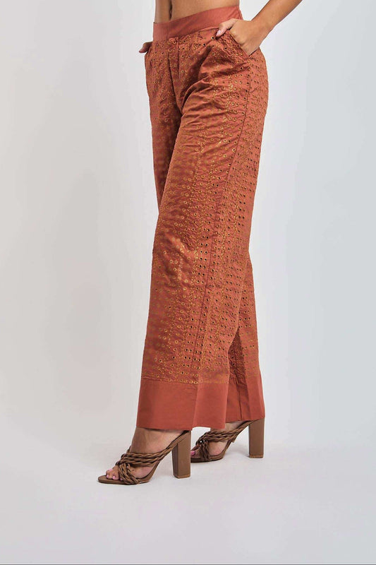 Women's high-waisted burnt orange embroidered wide-leg pants with pockets