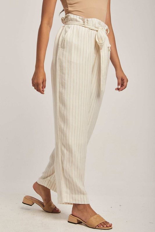 Dalydress women's cream striped wide-leg pants with a tie waist, styled with beige sandals