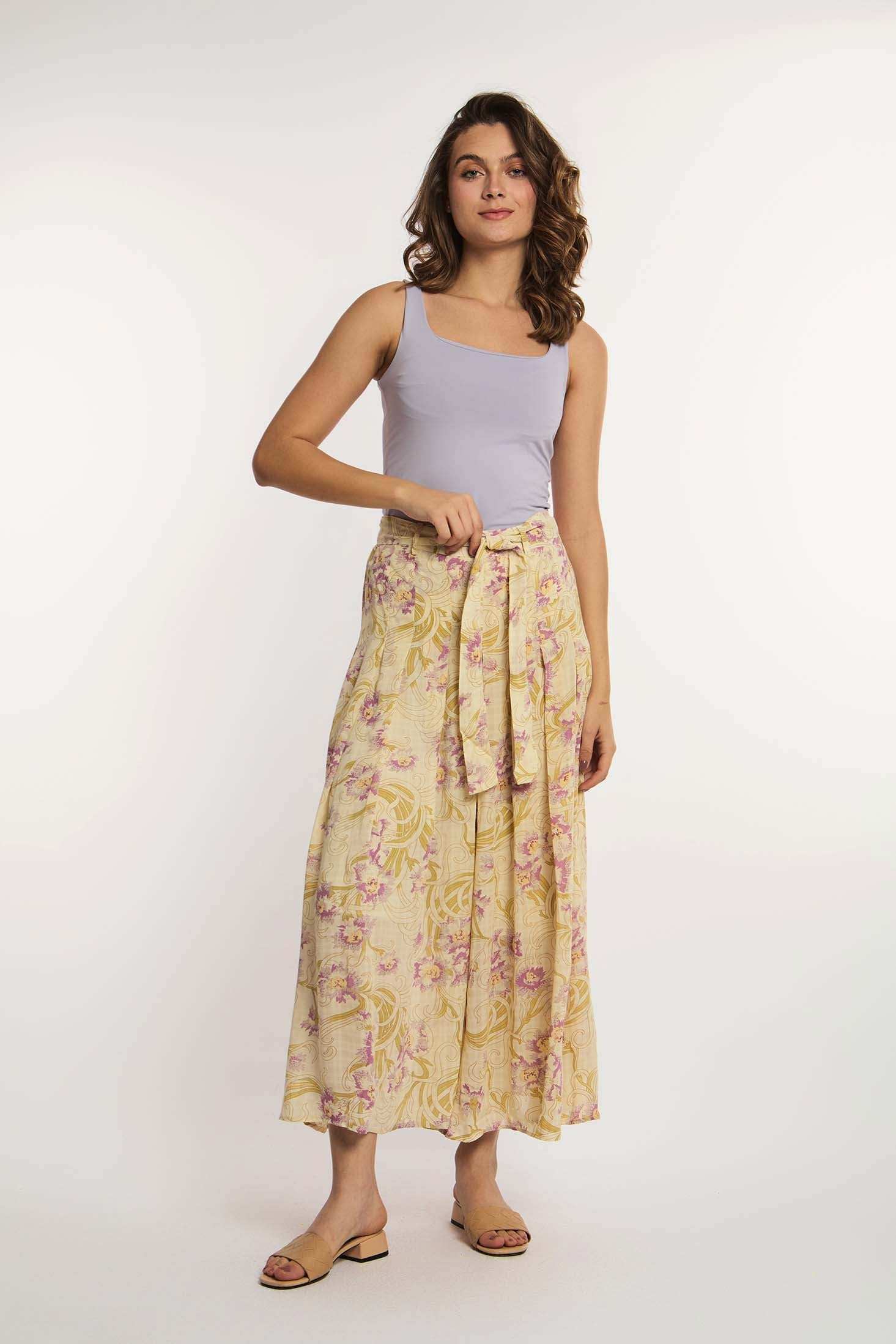 Woman in lilac tank top and yellow floral midi skirt by Dalydress, casual fashion
