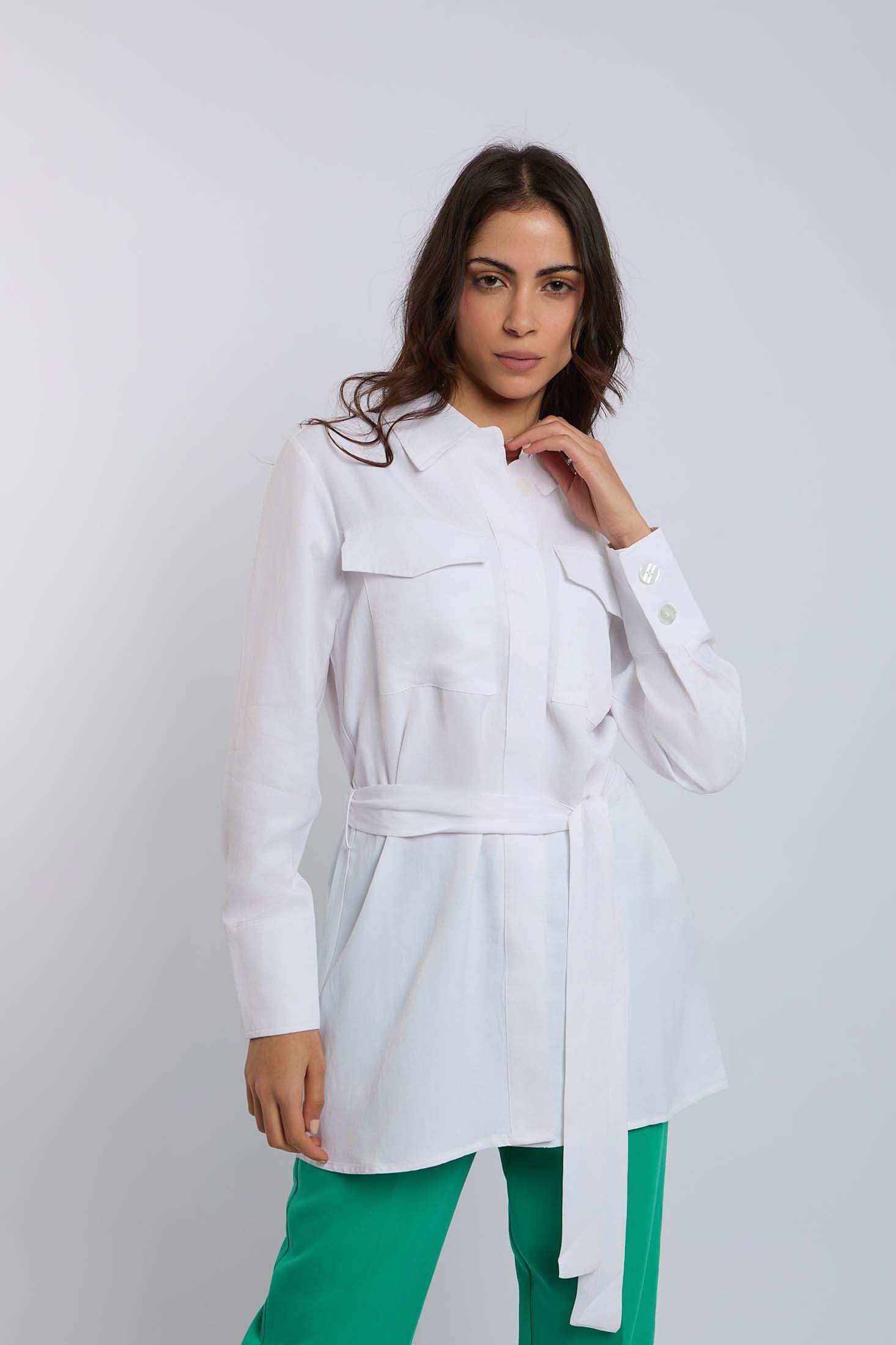 Woman wearing Dalydress white belted shirt with pockets and green pants, casual modern style
