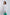 Woman wearing Dalydress white belted shirt and green pants, modern minimalist fashion