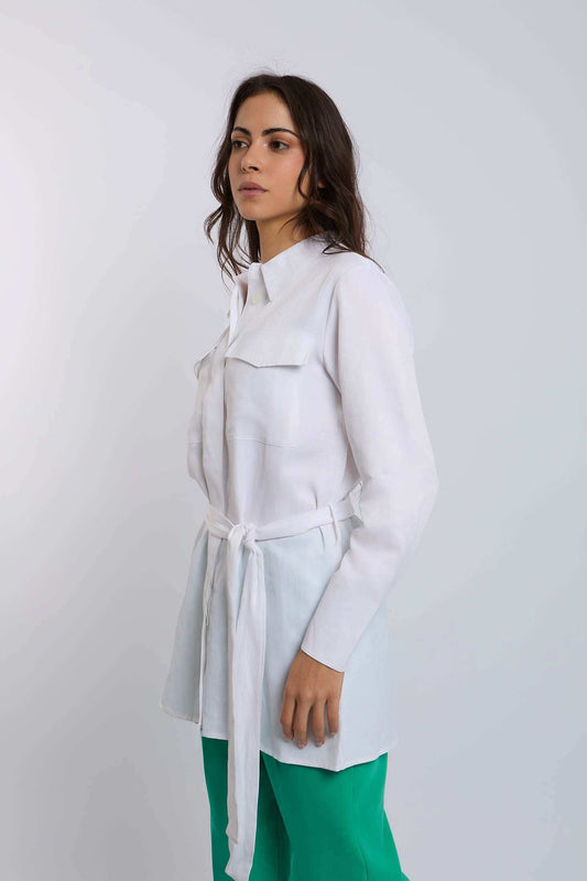 Woman wearing Dalydress white belted shirt and green pants, modern minimalist fashion