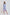Woman wearing Dalydress blue striped shirt dress with pink floral embroidery, standing indoors