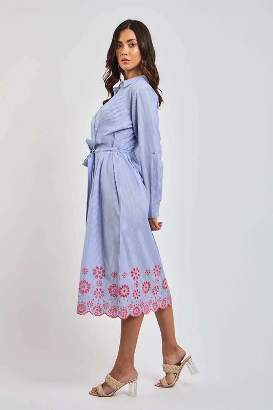 Woman wearing Dalydress blue striped shirt dress with red floral embroidery and belted waist