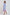 Woman wearing Dalydress blue striped shirt dress with red floral embroidery and belted waist