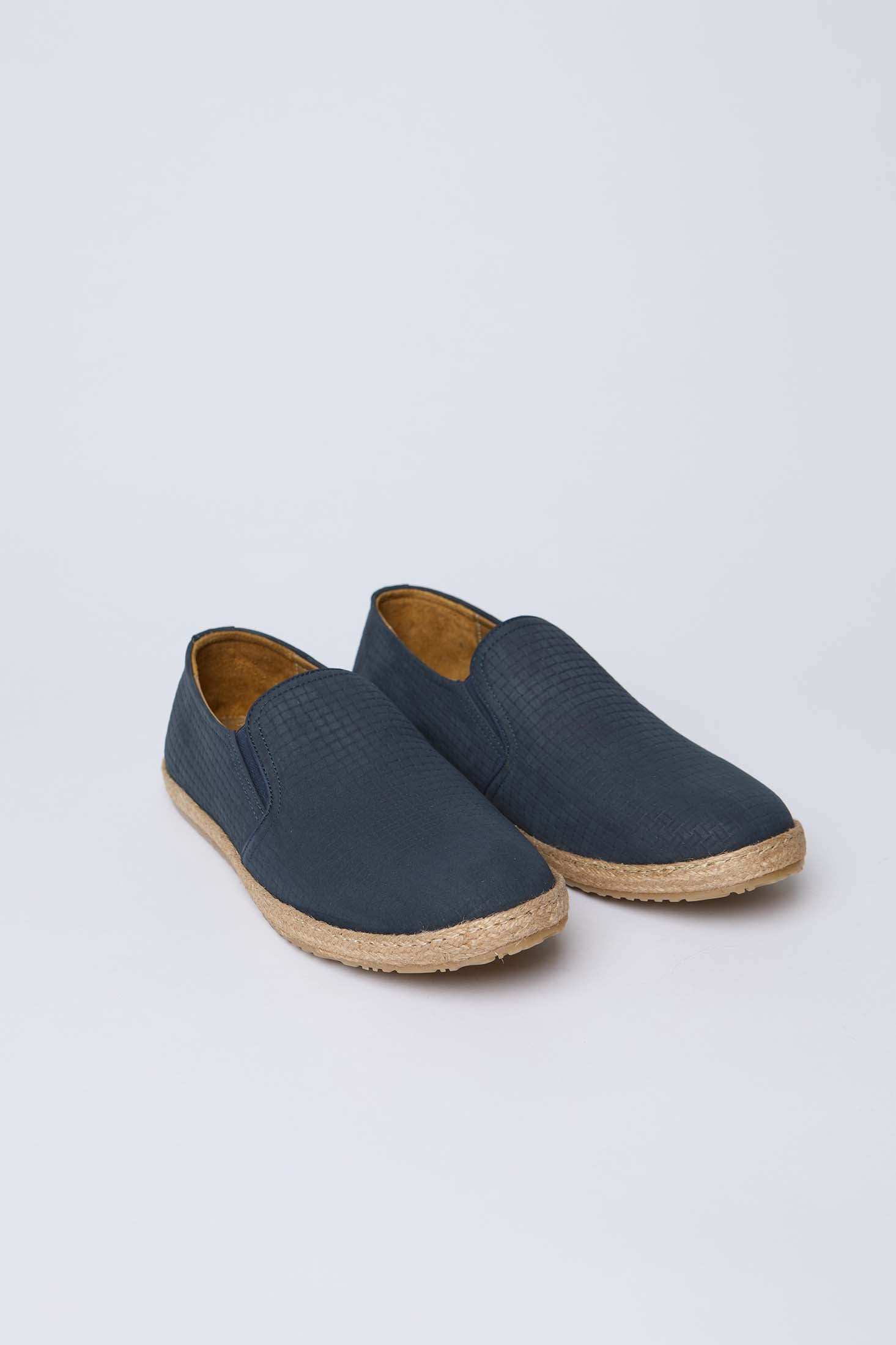 Men’s navy slip-on shoes with textured upper and woven sole on white background, Dalydress