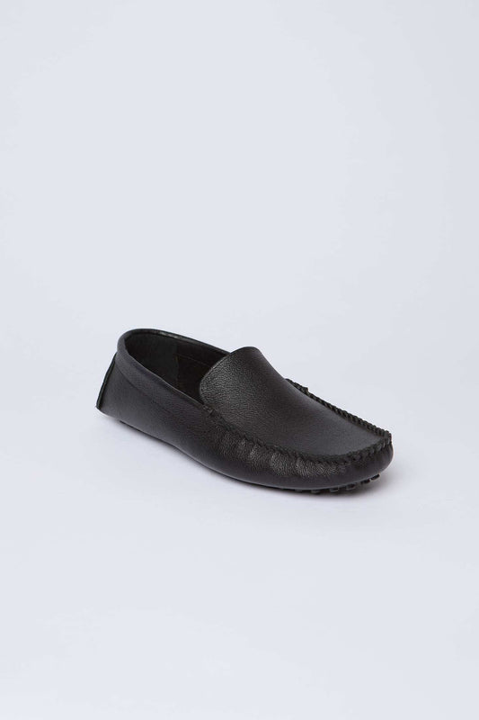 Dalydress black leather men's loafer shoe on white background, casual urban style