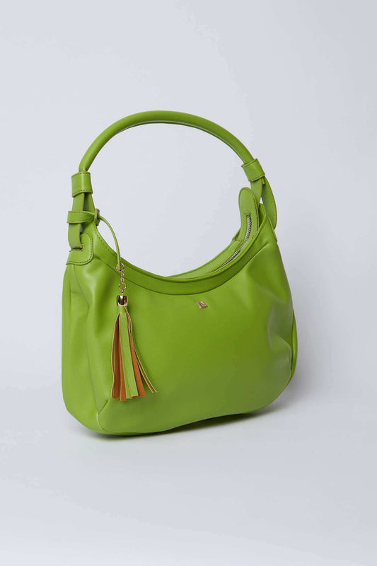 Green leather shoulder bag with zipper and multicolor tassel keychain on white background