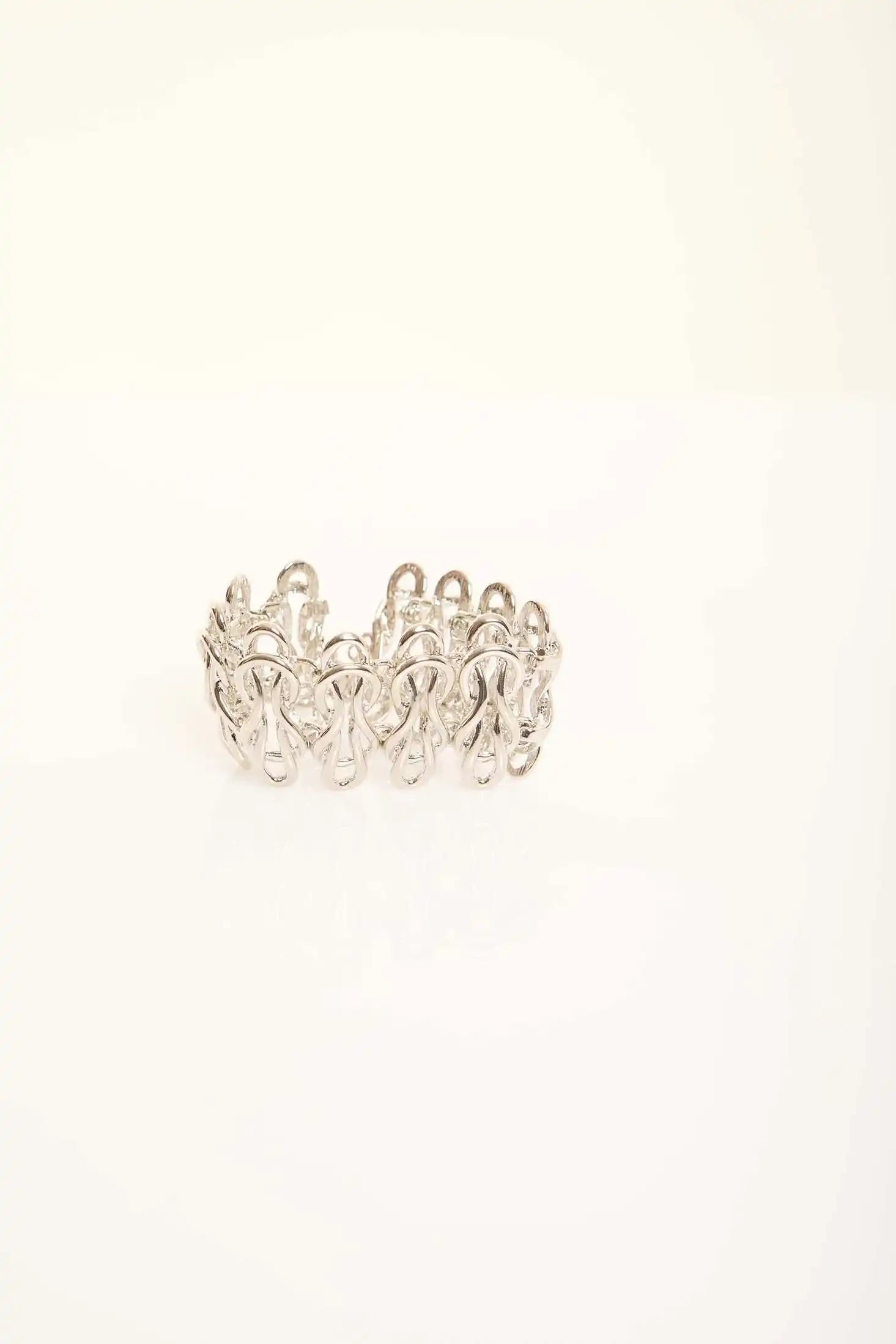 Elegant Sculpted Metal Bangle with Linked Pattern